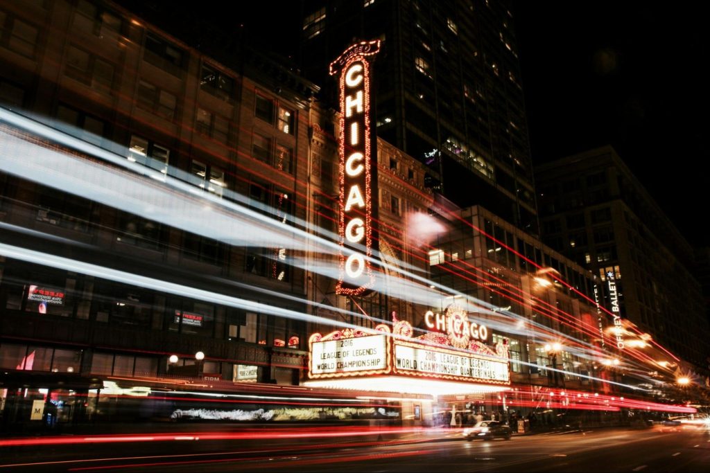 Chicago Theatre marquee lighting up downtown at night