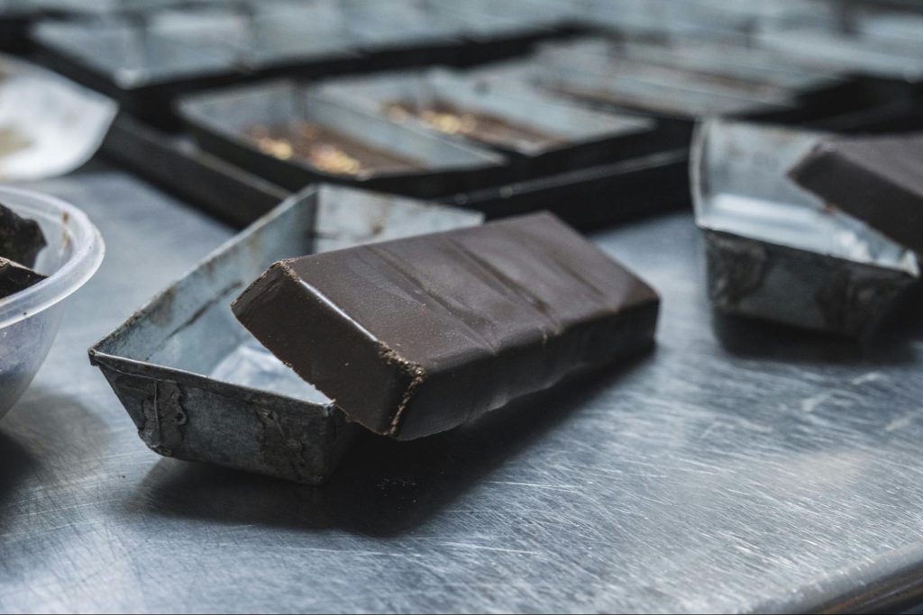 Traditional Sicilian chocolate bar in metal mold during production