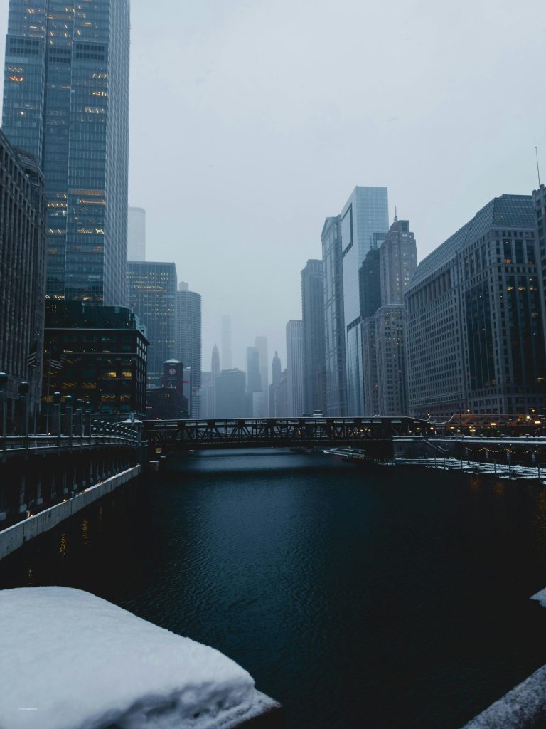 Chicago River downtown skyline during winter snowfall