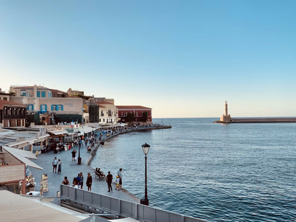 Chania Old Town waterfront with lighthouse and promenade in Crete