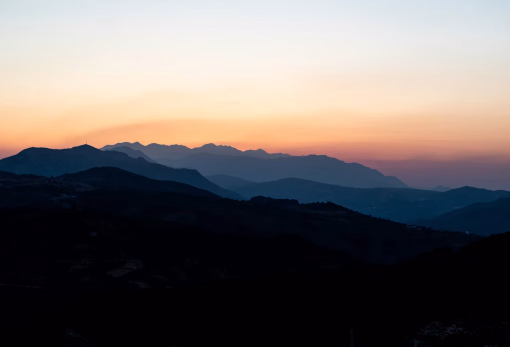Mountain silhouettes at sunset over Crete landscape