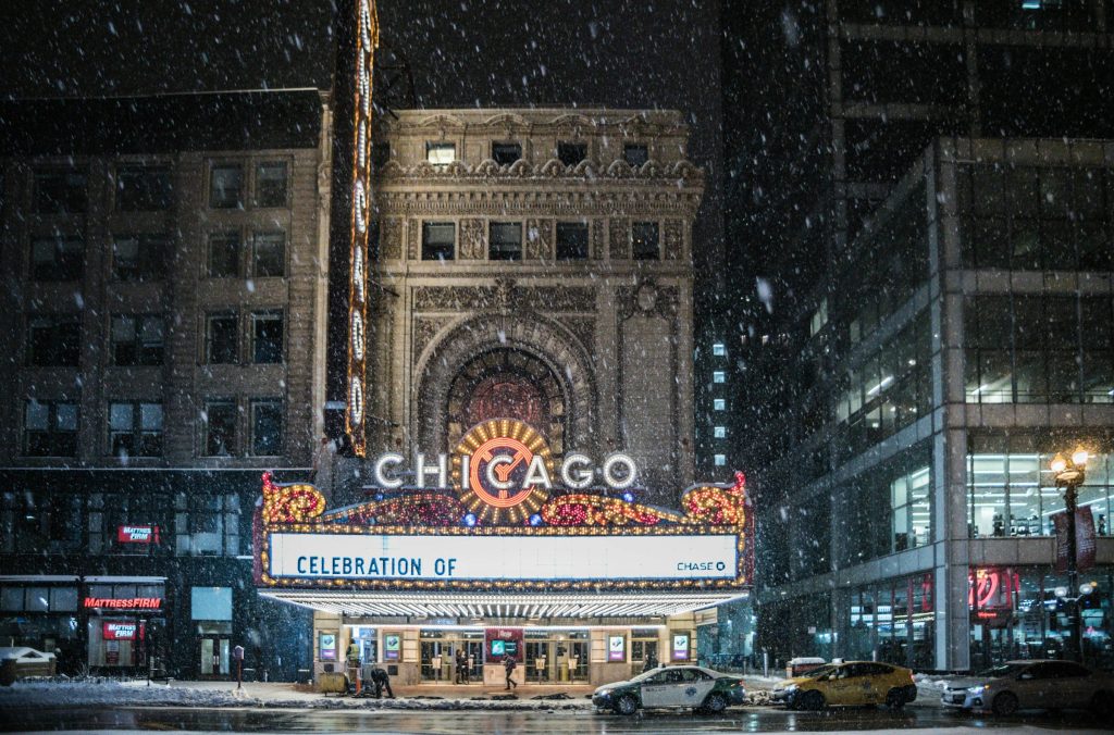 Chicago Theatre sign during winter snowfall